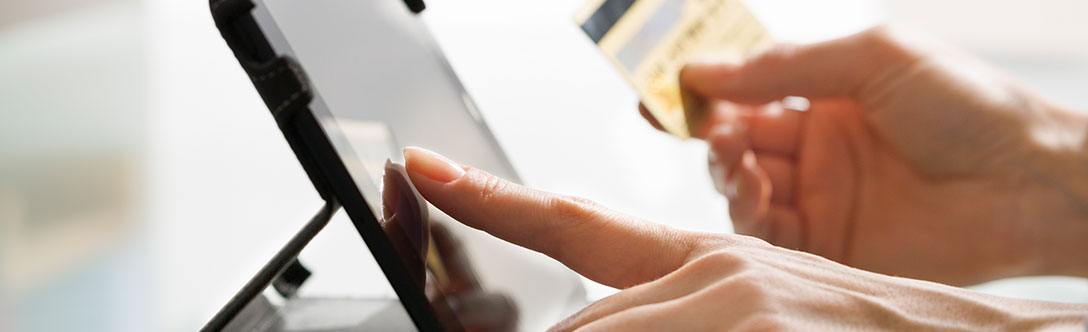 A woman registering for a program on her tablet