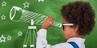 Child looking through telescope