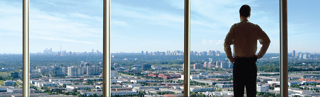 Man in Richmond Hill, looking over the City with Toronto in the background