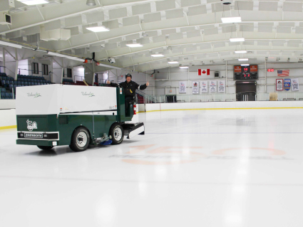 Richmond Hill arena facility operator with ice resurfacer on ice rink