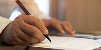 Candidate signing a form